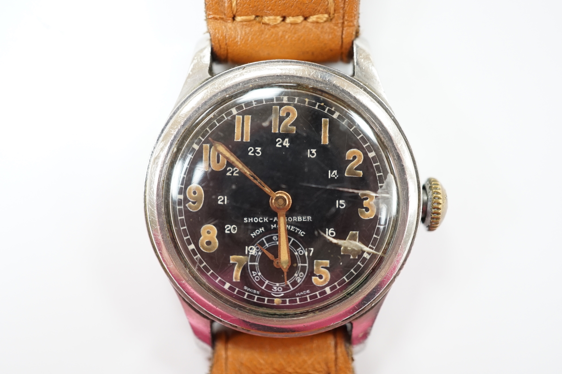 A gentleman's 1940's/1950's stainless steel manual wind wrist watch, with black Arabic dial and subsidiary seconds, on later associated leather strap.